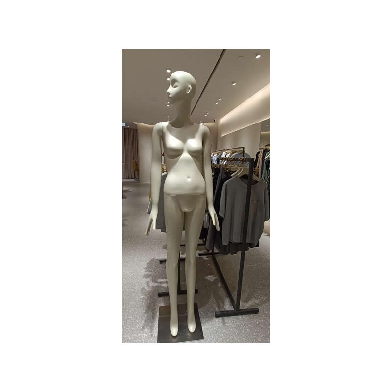 White female full-body mannequin with facial features, three-quarter view