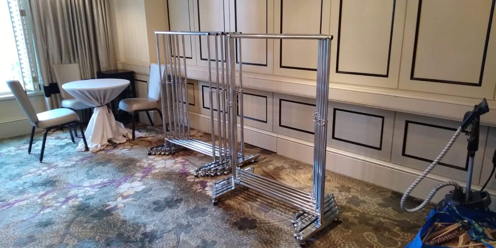 Empty clothes racks on wheels