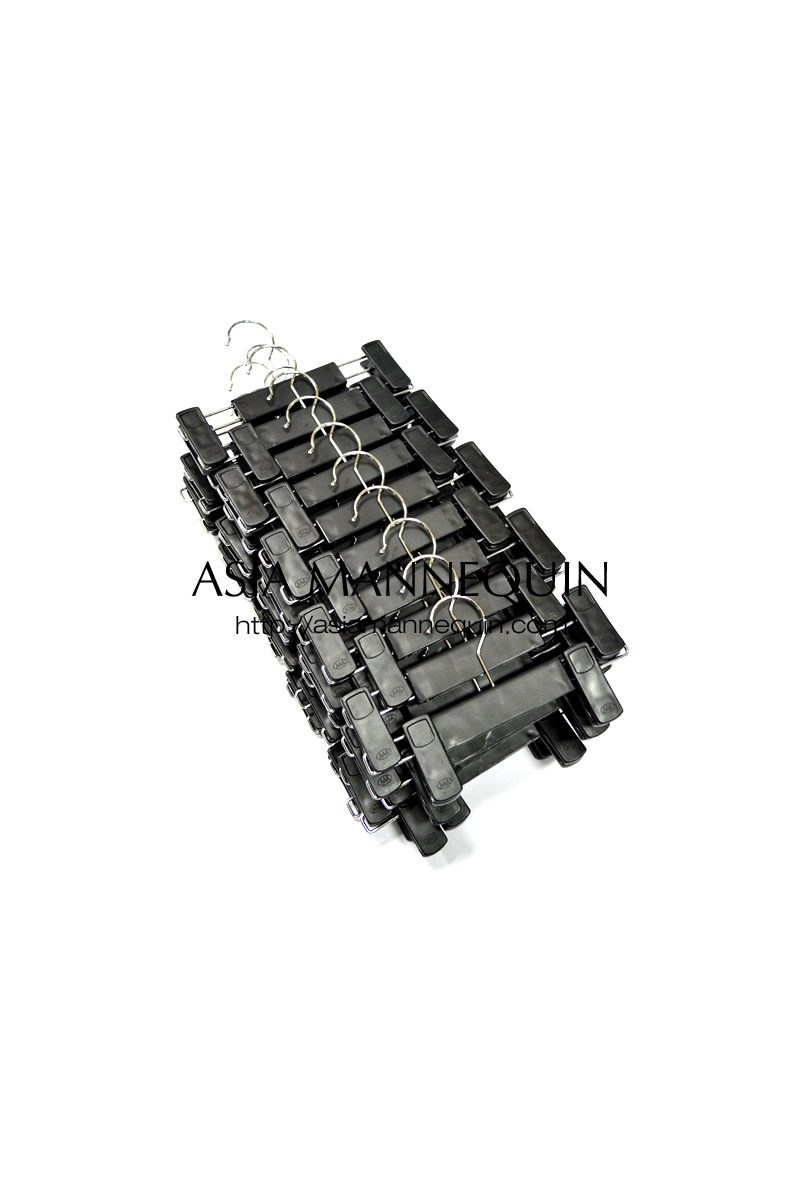 Stacked black clip hangers, with two clips on each bar.