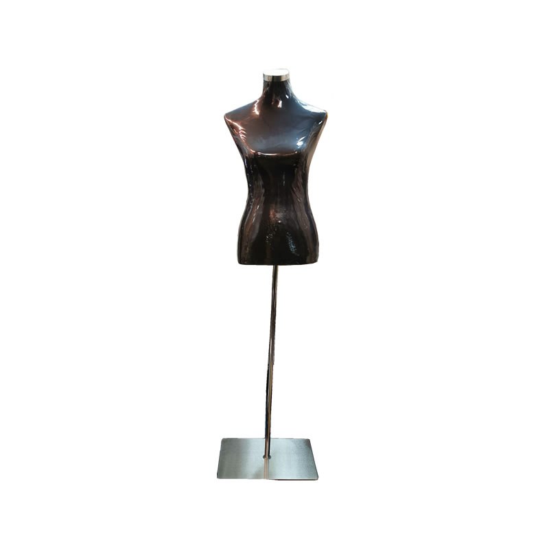Glossy black female torso dress form on a bright upright with a flat square base.