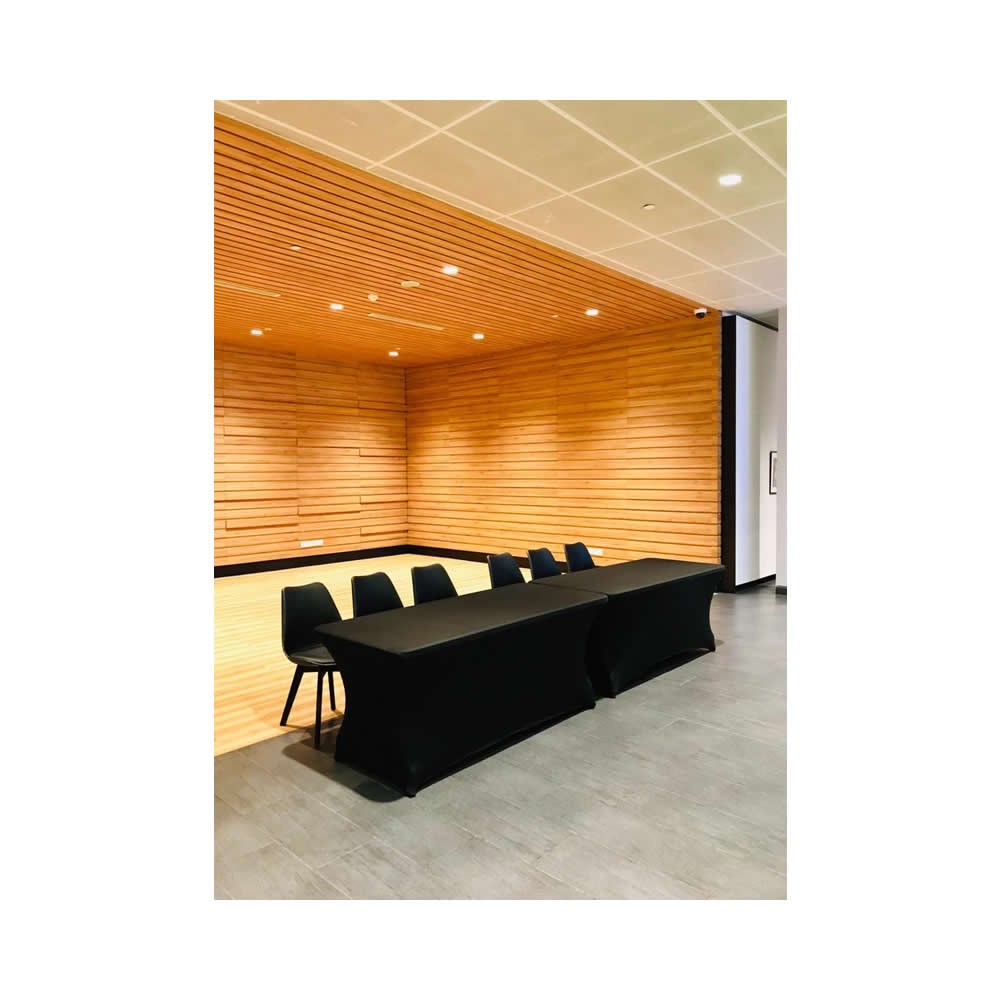 Tables with black covers arranged in a room
